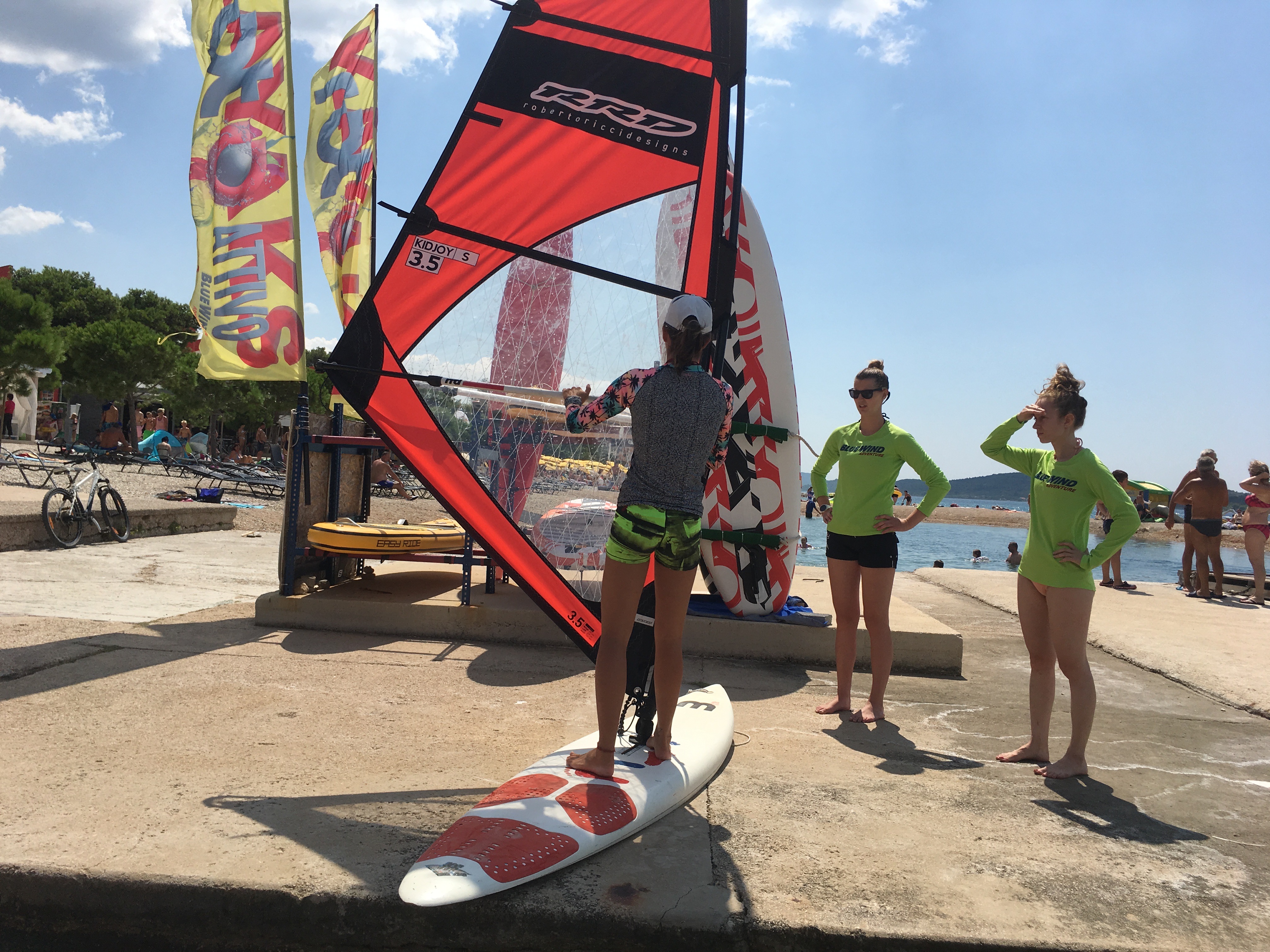 Bluewind Adventure instructor teaching the basics of windsurfing on the land